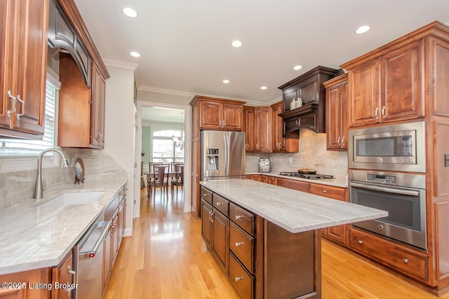 18705 Weymuth Ln, Louisville, KY 40245 - kitchen with appliances with stainless steel finishes, a sink, light wood-style floors, a center island, and crown molding