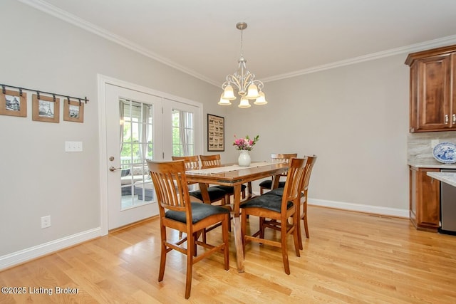 18705 Weymuth Ln, Louisville, KY 40245 - dining space featuring light wood-style flooring, ornamental molding, a chandelier, baseboards, and french doors