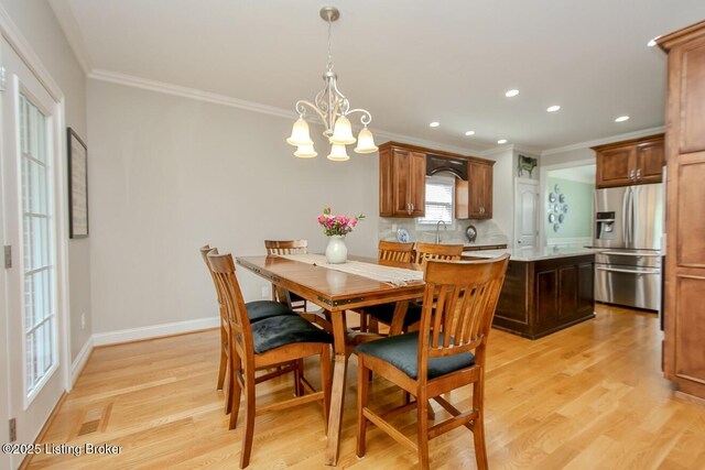 18705 Weymuth Ln, Louisville, KY 40245 - dining area featuring ornamental molding, a chandelier, light wood-style floors, recessed lighting, and baseboards