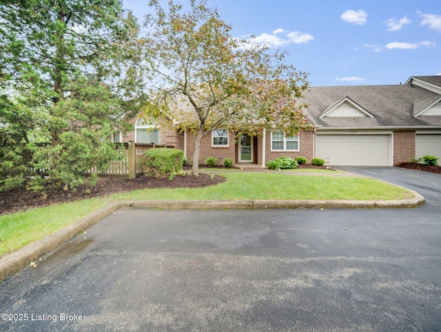 7906 Tuckaway Ct, Louisville, KY 40291 - view of front of home with asphalt driveway, a garage, and brick siding