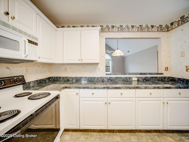 7906 Tuckaway Ct, Louisville, KY 40291 - kitchen with range with electric cooktop, white microwave, white cabinets, and dark countertops