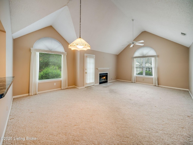7906 Tuckaway Ct, Louisville, KY 40291 - unfurnished living room with vaulted ceiling, a ceiling fan, carpet floors, a fireplace with flush hearth, and baseboards