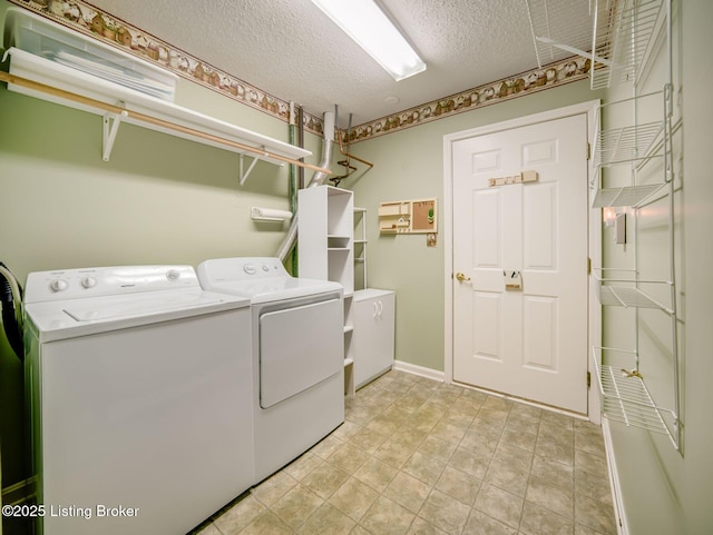 7906 Tuckaway Ct, Louisville, KY 40291 - clothes washing area with independent washer and dryer, a textured ceiling, and baseboards