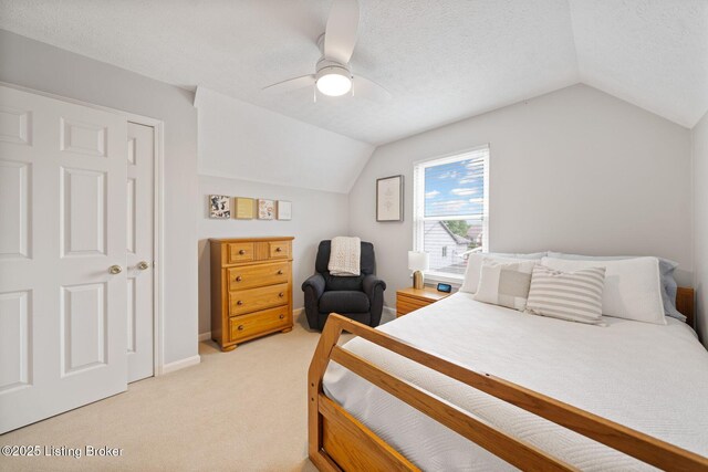 bedroom featuring lofted ceiling, light carpet, a ceiling fan, and baseboards
