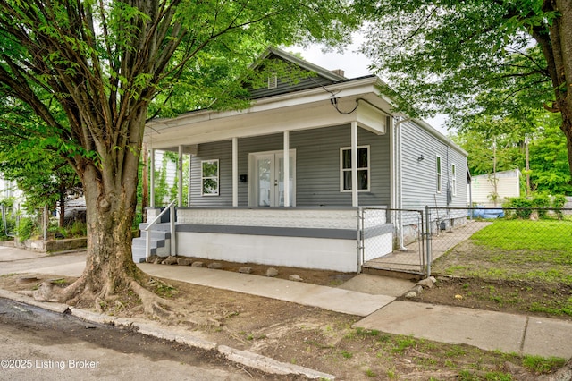 474 N 29th St, Louisville, KY 40212 - shotgun-style home featuring covered porch, a gate, and fence