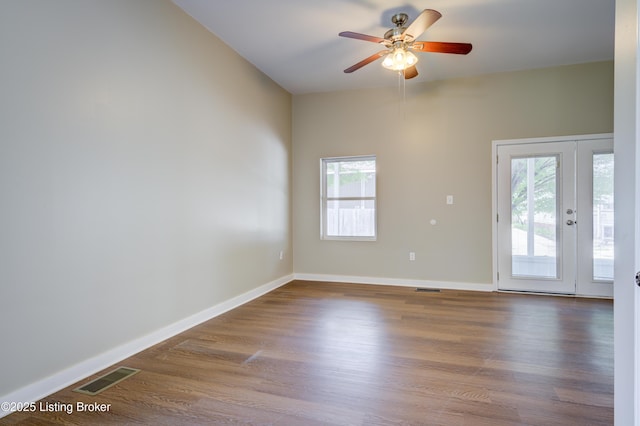 474 N 29th St, Louisville, KY 40212 - unfurnished room with a ceiling fan, wood finished floors, and healthy amount of natural light