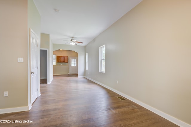 474 N 29th St, Louisville, KY 40212 - empty room with a ceiling fan, lofted ceiling, wood finished floors, baseboards, and a smoke detector