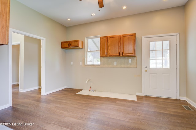 474 N 29th St, Louisville, KY 40212 - kitchen with brown cabinetry, wood finished floors, a ceiling fan, healthy amount of natural light, and recessed lighting