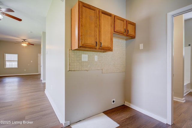 474 N 29th St, Louisville, KY 40212 - kitchen featuring ceiling fan, wood finished floors, brown cabinetry, and tasteful backsplash