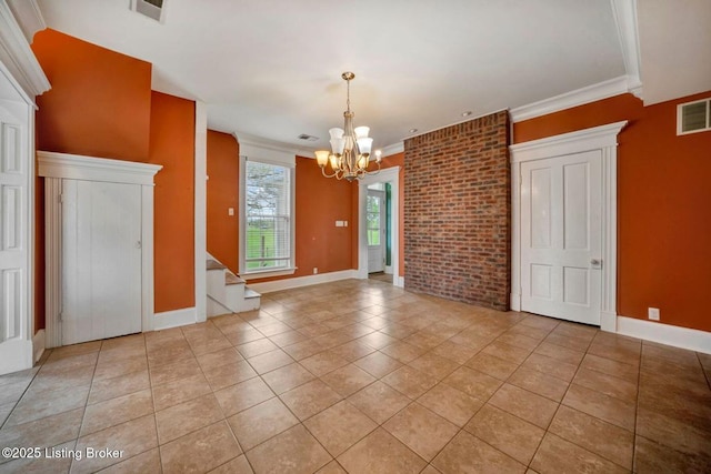 empty room featuring a chandelier, light tile patterned floors, stairway, crown molding, and baseboards
