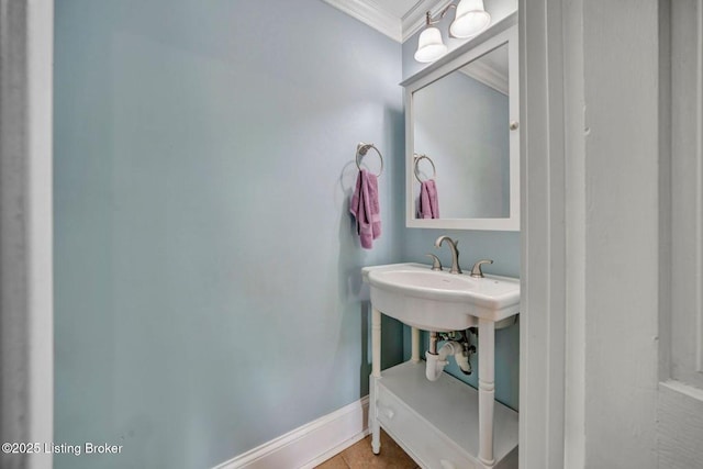 bathroom with ornamental molding, baseboards, and tile patterned flooring