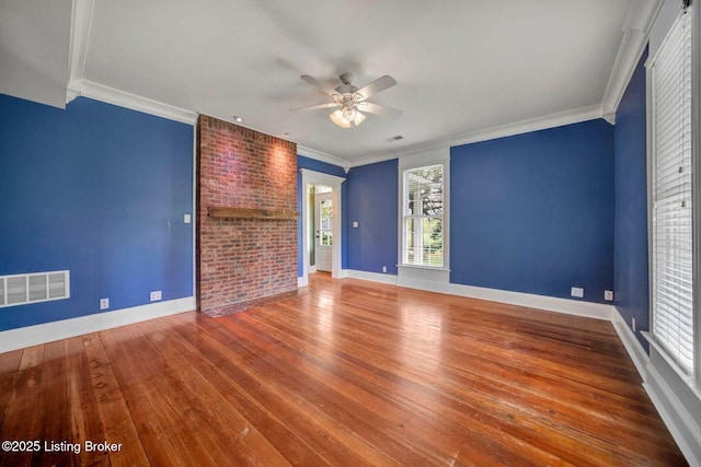 spare room featuring ceiling fan, hardwood / wood-style flooring, ornamental molding, and baseboards