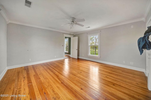 empty room featuring a ceiling fan, light wood-style floors, baseboards, and ornamental molding