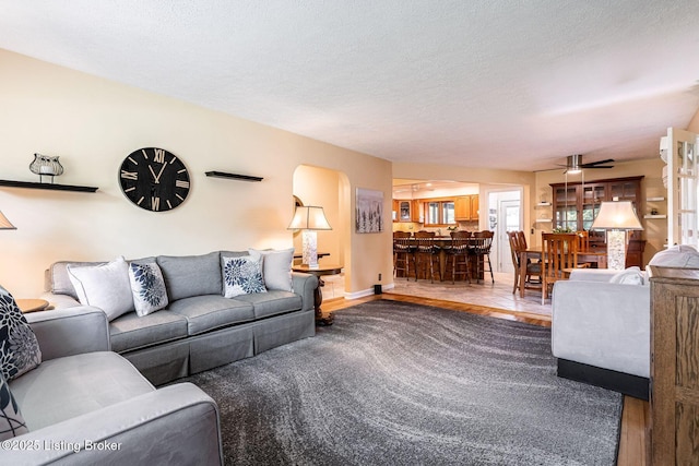 8703 Waltlee Rd, Louisville, KY 40291 - living room with ceiling fan, baseboards, and a textured ceiling