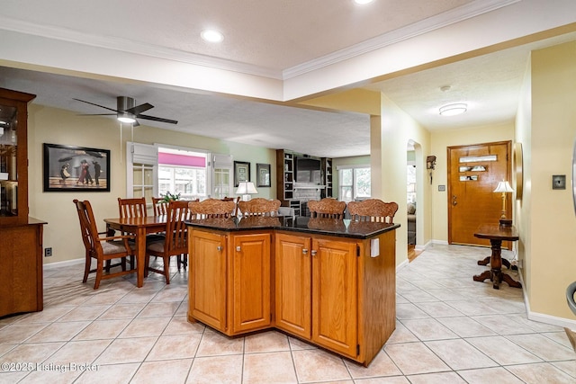 8703 Waltlee Rd, Louisville, KY 40291 - kitchen with light tile patterned floors, dark stone counters, baseboards, ornamental molding, and recessed lighting