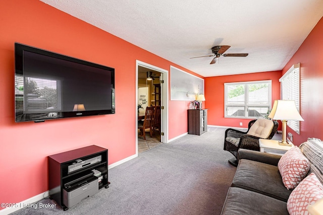 8703 Waltlee Rd, Louisville, KY 40291 - carpeted living room featuring ceiling fan, a textured ceiling, and baseboards