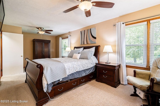 8703 Waltlee Rd, Louisville, KY 40291 - bedroom with light colored carpet, ceiling fan, and a textured ceiling