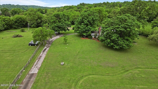 aerial view of property's location featuring a heavily wooded area