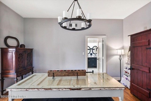 entrance foyer with a chandelier and wood finished floors