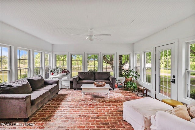 sunroom with french doors and brick floors