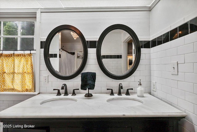 full bathroom with decorative backsplash and double vanity