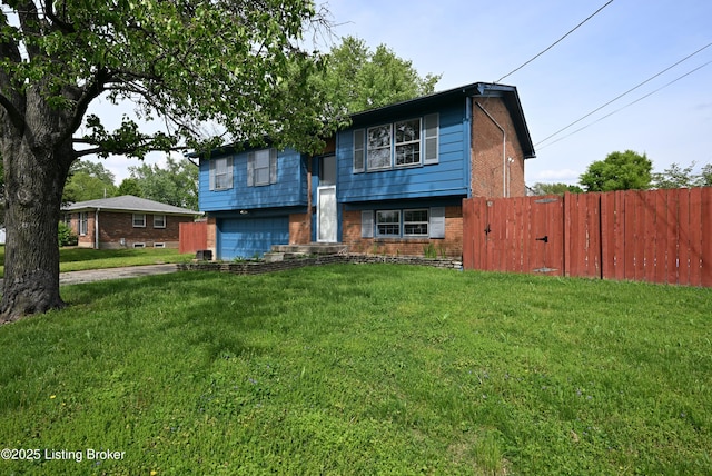 4433 Malcolm Rd, Louisville, KY 40216 - raised ranch featuring brick siding, an attached garage, and driveway