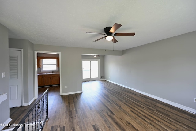 4433 Malcolm Rd, Louisville, KY 40216 - empty room with ceiling fan, dark wood-style floors, and baseboards