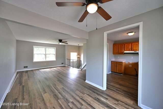 4433 Malcolm Rd, Louisville, KY 40216 - unfurnished living room with dark wood-style floors, a ceiling fan, and baseboards