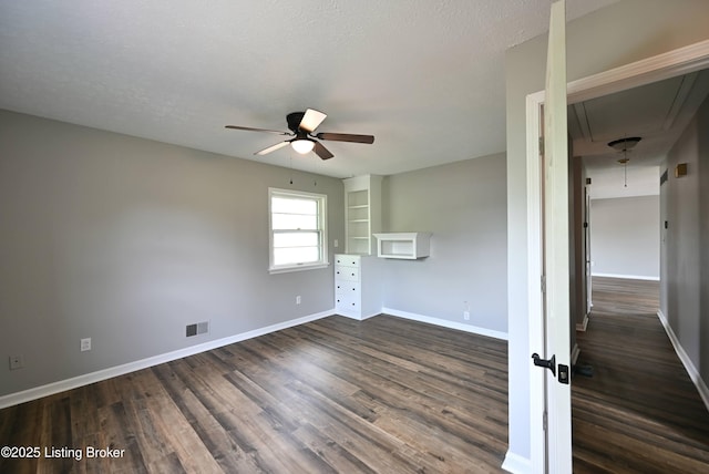 4433 Malcolm Rd, Louisville, KY 40216 - unfurnished bedroom with dark wood-style flooring, baseboards, and ceiling fan