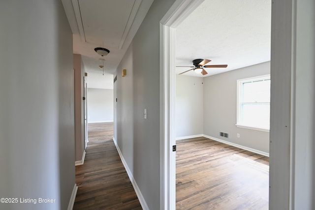 4433 Malcolm Rd, Louisville, KY 40216 - corridor featuring attic access, dark wood finished floors, and baseboards