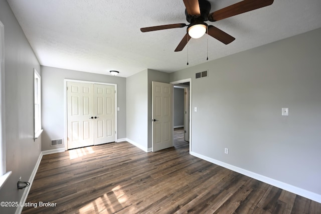 4433 Malcolm Rd, Louisville, KY 40216 - unfurnished bedroom featuring baseboards, dark wood-style floors, a closet, a textured ceiling, and a ceiling fan