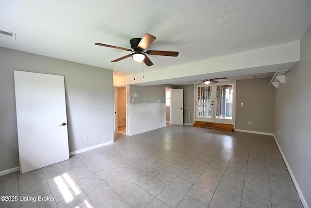 4433 Malcolm Rd, Louisville, KY 40216 - spare room with ceiling fan, light tile patterned floors, baseboards, and a textured ceiling