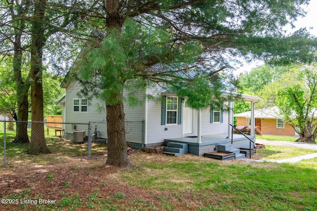 rear view of house featuring cooling unit