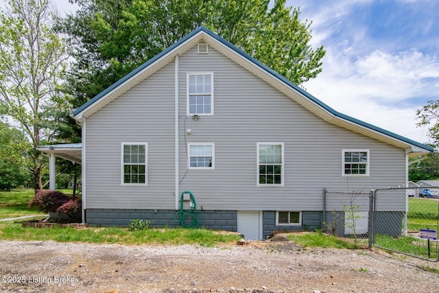 view of property exterior with fence