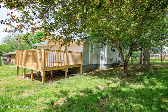 rear view of house with a wooden deck