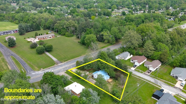 aerial view of property and surrounding area featuring property parcel outlined