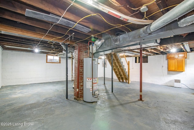 below grade area with gas water heater and stairs