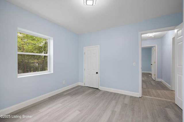 5319 New Cut Rd, Louisville, KY 40214 - unfurnished bedroom featuring wood finished floors and baseboards