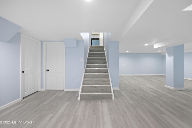 5319 New Cut Rd, Louisville, KY 40214 - stairs featuring baseboards, wood finished floors, and recessed lighting