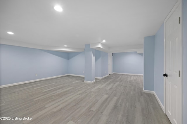 5319 New Cut Rd, Louisville, KY 40214 - finished below grade area featuring recessed lighting, baseboards, and wood finished floors