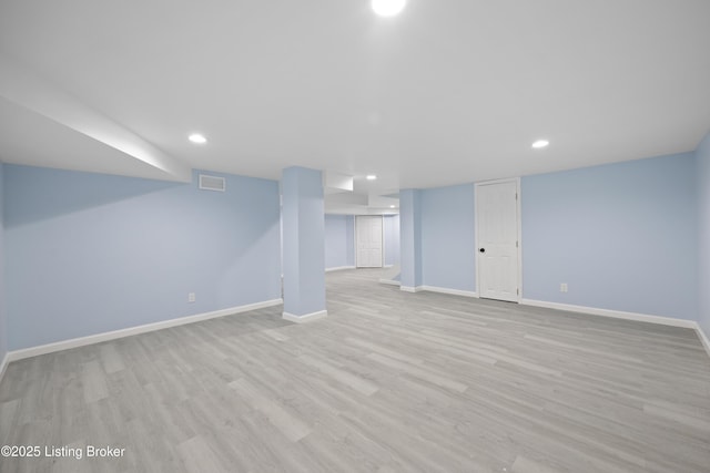 5319 New Cut Rd, Louisville, KY 40214 - finished below grade area with baseboards, wood finished floors, and recessed lighting