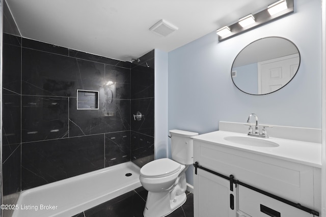 5319 New Cut Rd, Louisville, KY 40214 - full bath with vanity, toilet, a tile shower, and tile patterned flooring