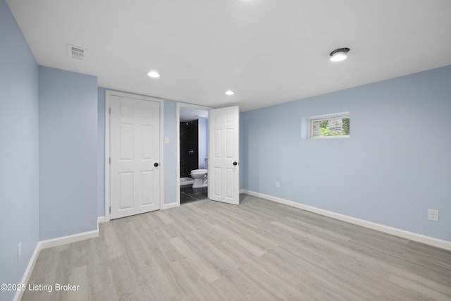 5319 New Cut Rd, Louisville, KY 40214 - below grade area with baseboards, light wood finished floors, and recessed lighting