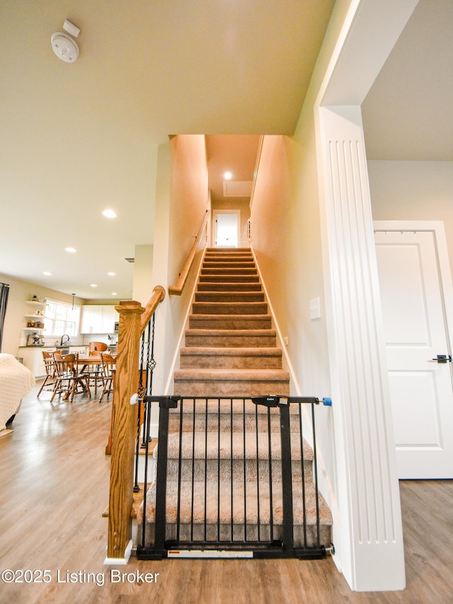 9206 Fox Chase Rd, Louisville, KY 40228 - stairs with wood finished floors and recessed lighting