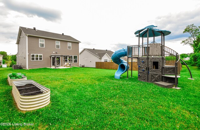 9206 Fox Chase Rd, Louisville, KY 40228 - rear view of property featuring a playground, a patio area, and central AC