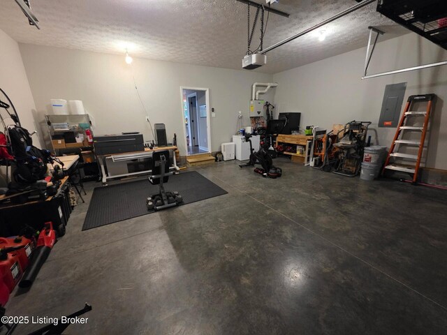 9206 Fox Chase Rd, Louisville, KY 40228 - garage with a garage door opener, a workshop area, electric panel, and water heater