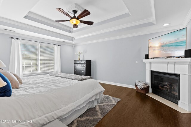 4026 Old Farm Dr, Crestwood, KY 40014 - bedroom featuring a raised ceiling, crown molding, wood finished floors, a fireplace with flush hearth, and recessed lighting