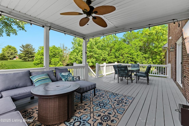 4026 Old Farm Dr, Crestwood, KY 40014 - wooden deck with outdoor lounge area, outdoor dining area, a ceiling fan, and view of wooded area