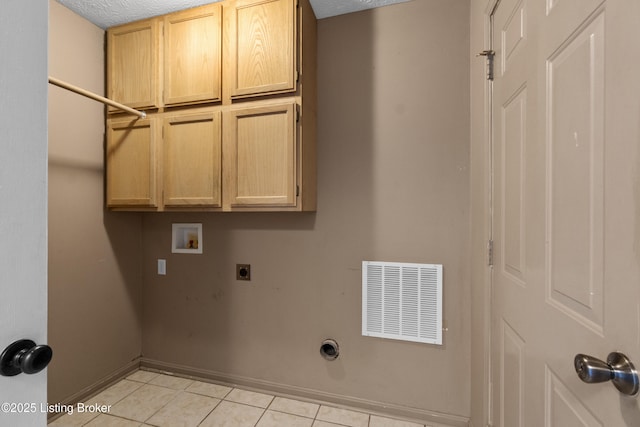 267 Stellar Dr, Shepherdsville, KY 40165 - clothes washing area with cabinet space, electric dryer hookup, hookup for a washing machine, light tile patterned floors, and baseboards