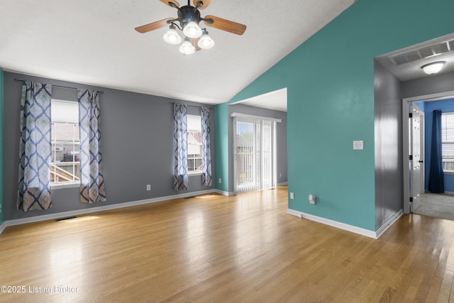 267 Stellar Dr, Shepherdsville, KY 40165 - spare room with wood finished floors, a ceiling fan, plenty of natural light, vaulted ceiling, and baseboards